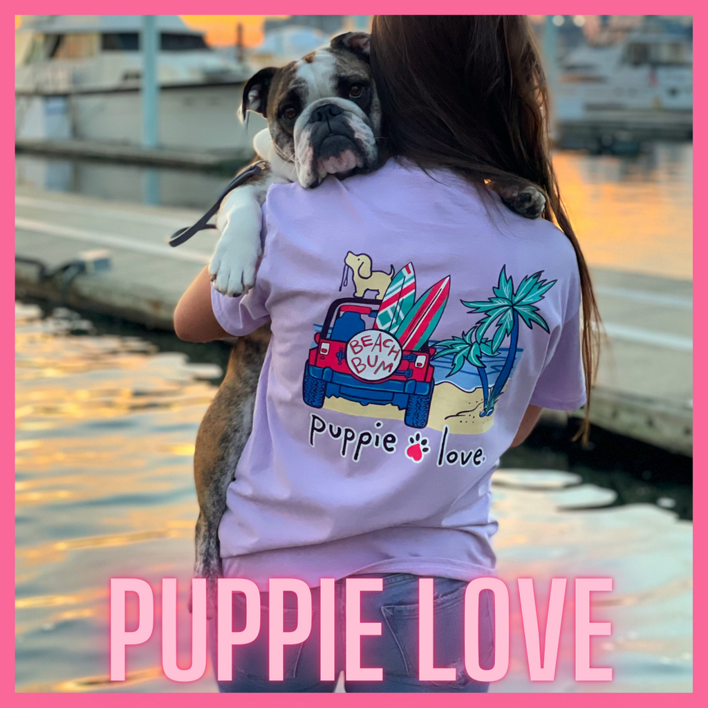 Puppie Love Rescue Dog Tee Shirt. Featured on Lilac Shirt with Beach Bum Puppie Love Design. 